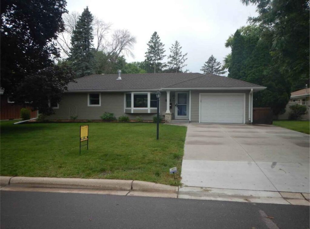 Single-story rambler home with attached garage in Minnesota neighborhood